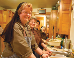 Cleaning horseradish from their community&rsquo;s vegetable garden are (from left) Sister Anna Rose Kalinowski, F.S.E, Sister Suzanne Gross, F.S.E., Sister Monica Navalta, F.S.E., and Sister Mary Richards, F.S.E. 
